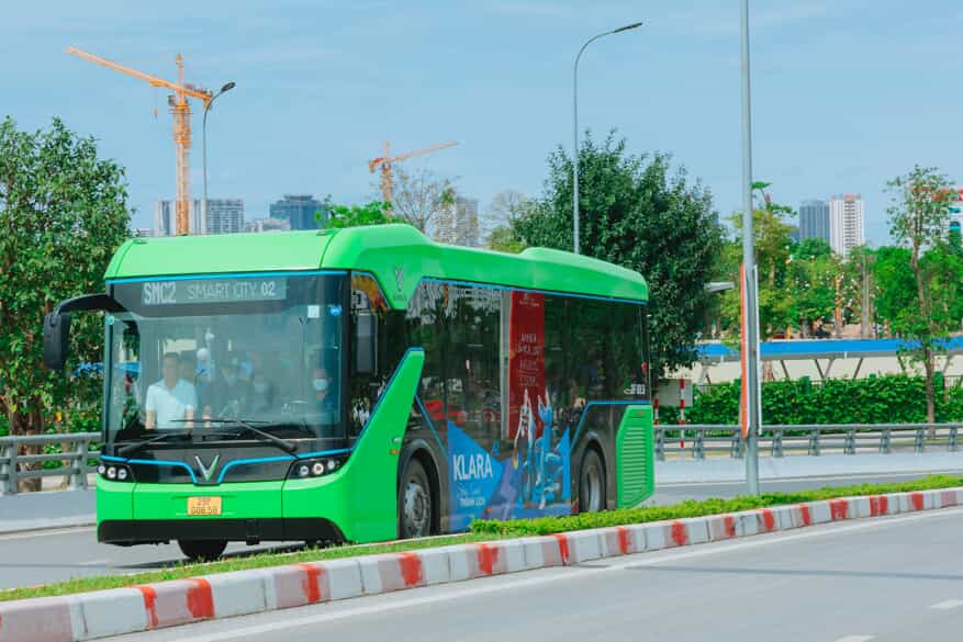 an electric bus driving down a road