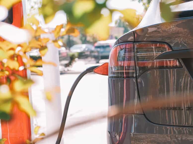 a close up shot of an electric car charging